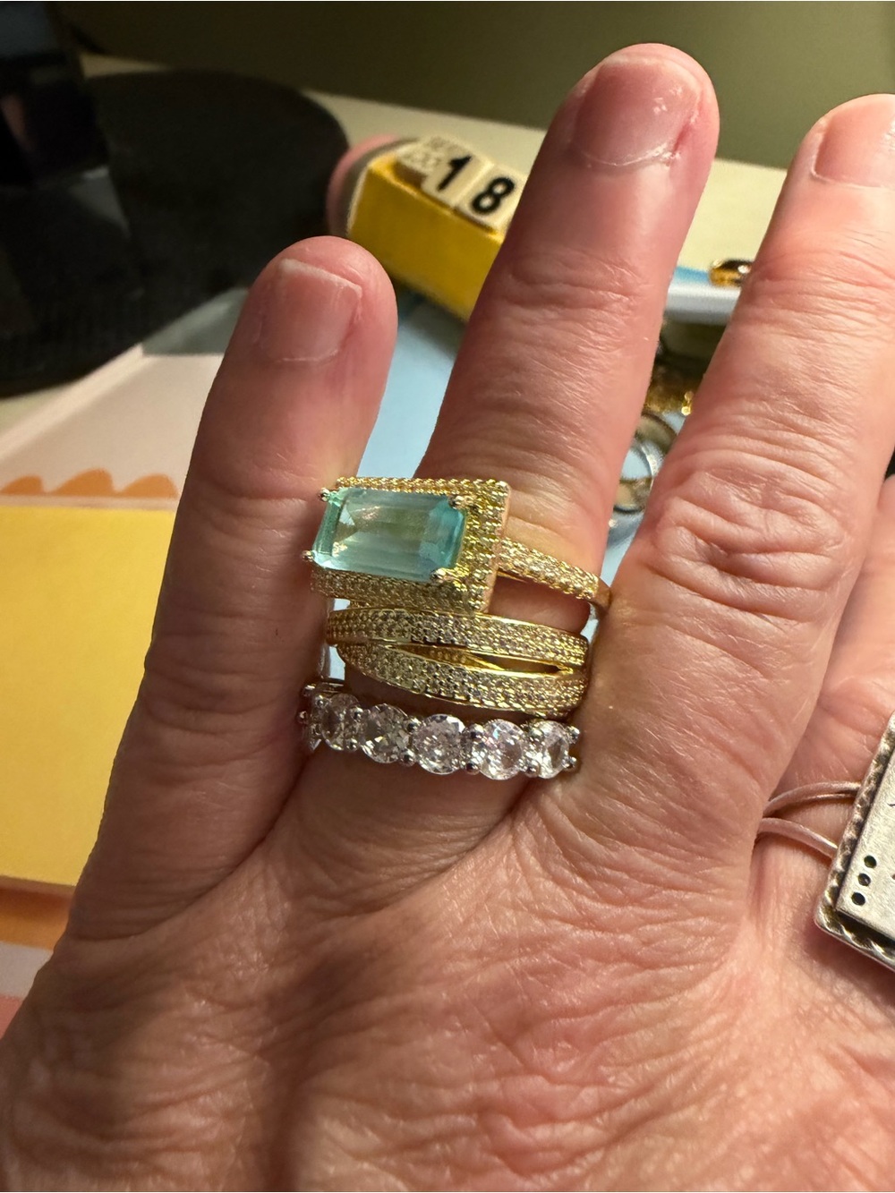 Source Unknown Gold Ring with Aquamarine-Tone Emerald Cut Stone and Pavé Bands